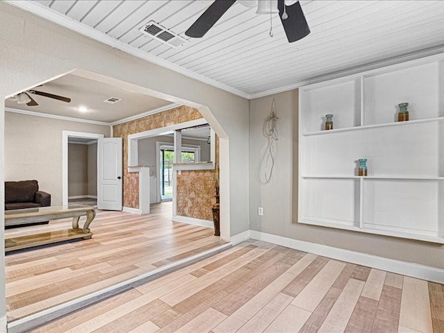 interior space with hardwood / wood-style floors, crown molding, and ceiling fan