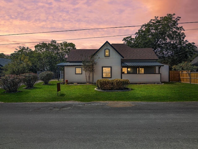 view of front of house with a lawn