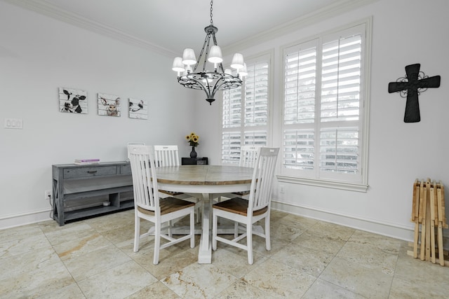 dining space with ornamental molding and a chandelier