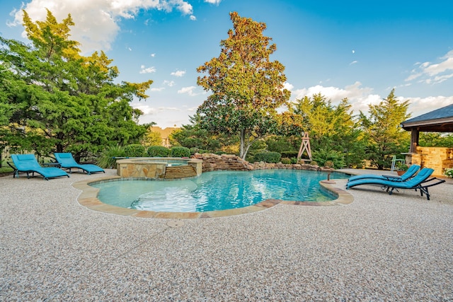 view of swimming pool with a gazebo, an in ground hot tub, and a patio