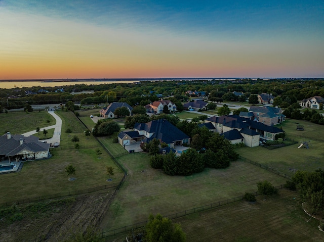 aerial view at dusk with a water view