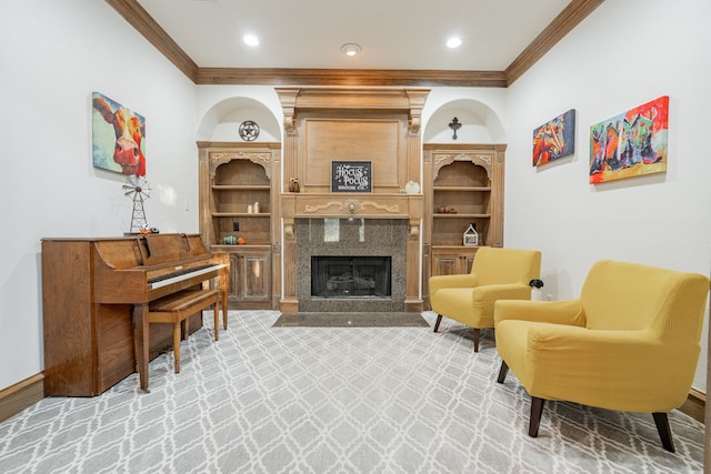 sitting room with crown molding and hardwood / wood-style floors