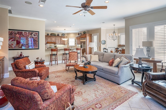 tiled living room featuring ceiling fan with notable chandelier, crown molding, and a healthy amount of sunlight