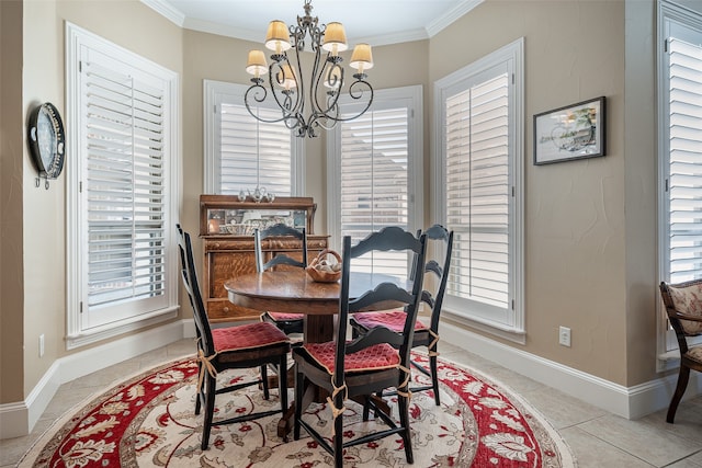 tiled dining room featuring an inviting chandelier, ornamental molding, and a wealth of natural light