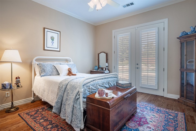 bedroom with ornamental molding, ceiling fan, dark hardwood / wood-style floors, and access to outside