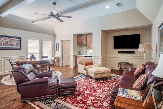 living room with lofted ceiling, hardwood / wood-style floors, and ceiling fan