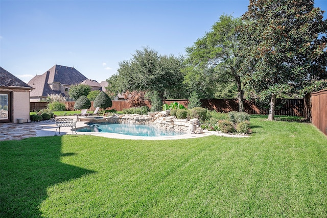 view of yard with a fenced in pool and a patio area