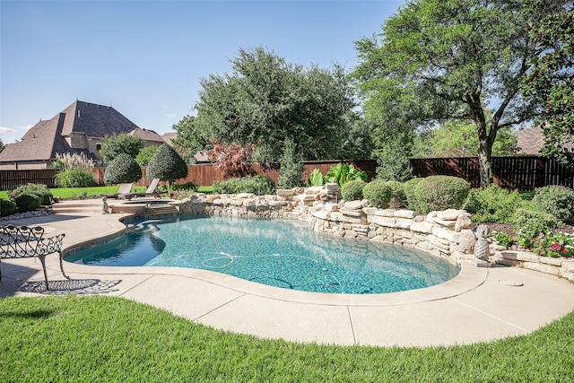 view of swimming pool with a patio and an in ground hot tub