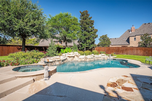 view of swimming pool with a patio and an in ground hot tub