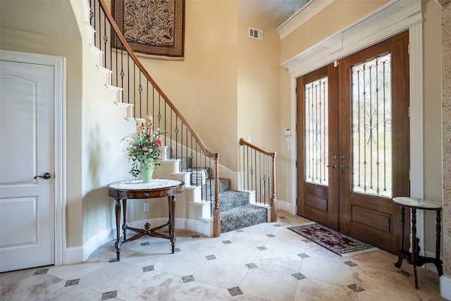 entrance foyer featuring french doors