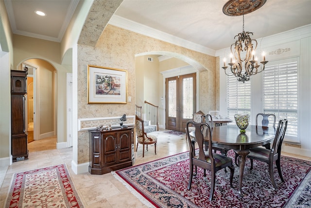 dining room featuring a chandelier and crown molding