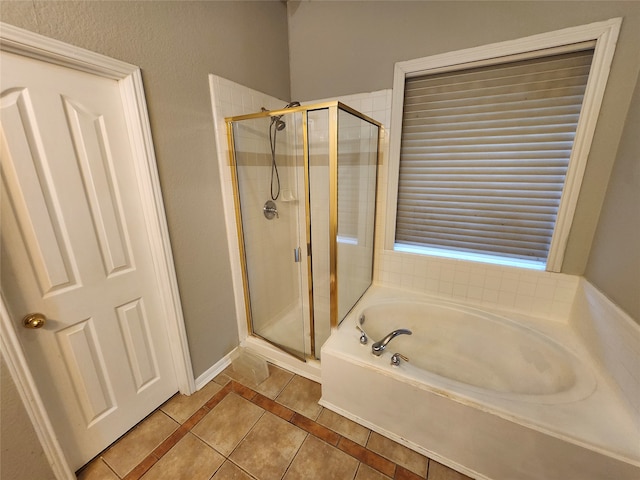 bathroom with plus walk in shower and tile patterned flooring