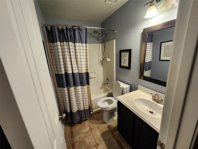 full bathroom with tile patterned floors, toilet, shower / tub combo, a textured ceiling, and vanity