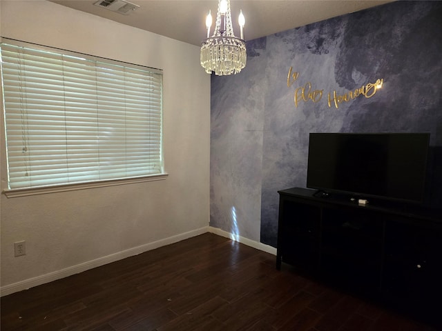 interior space with dark hardwood / wood-style floors and a chandelier