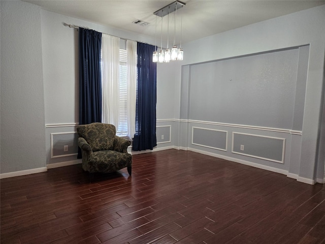 sitting room featuring dark hardwood / wood-style floors