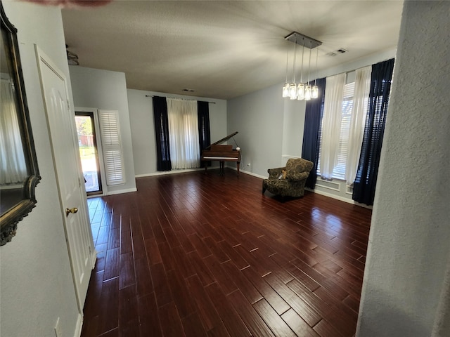 interior space featuring hardwood / wood-style floors and a notable chandelier