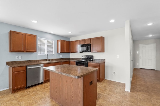 kitchen featuring black appliances, a kitchen island, and sink