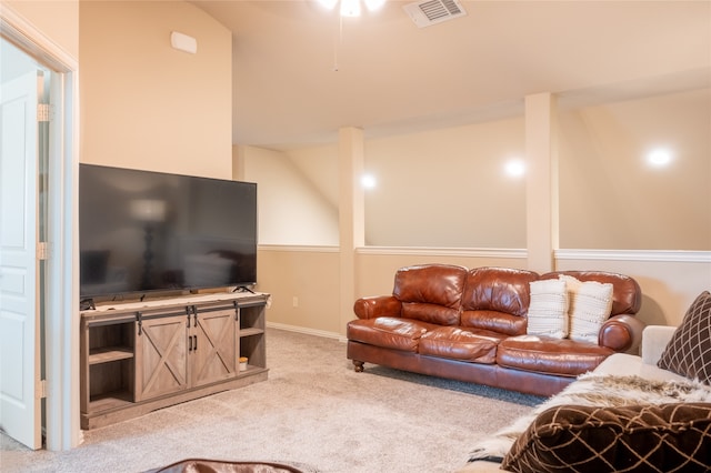 living room with carpet flooring and lofted ceiling