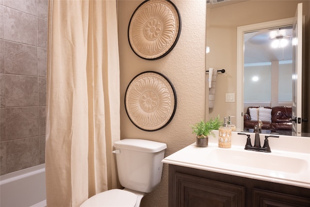 full bathroom featuring shower / tub combo, vanity, and toilet