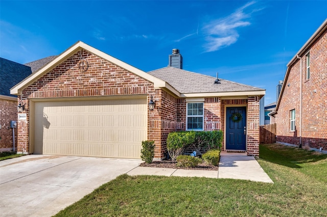 view of front of home with a garage and a front yard