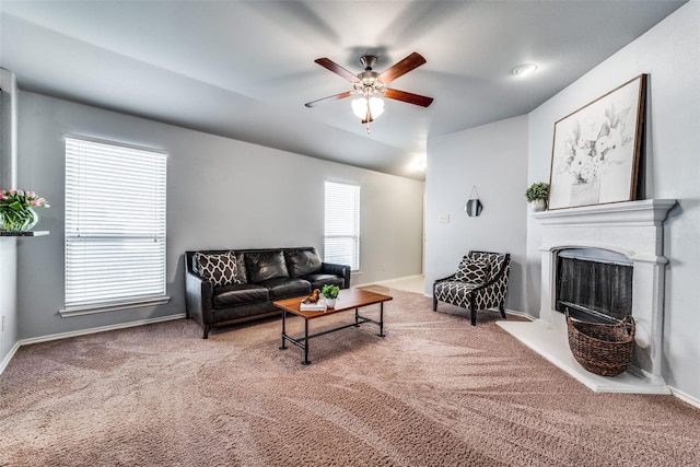 living room with carpet flooring, ceiling fan, and plenty of natural light