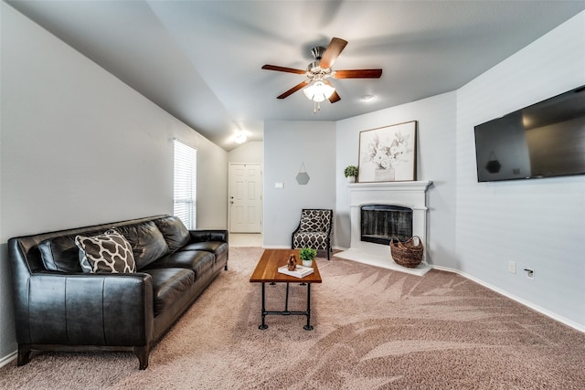 living room featuring carpet flooring, vaulted ceiling, and ceiling fan