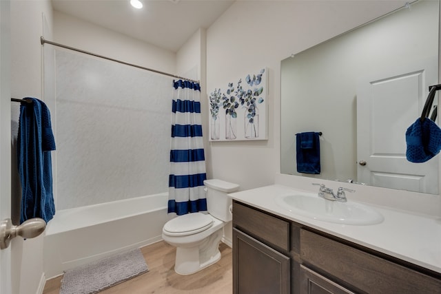 full bathroom featuring vanity, toilet, hardwood / wood-style flooring, and shower / bathtub combination with curtain