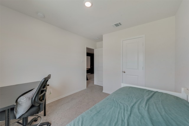 bedroom featuring light colored carpet