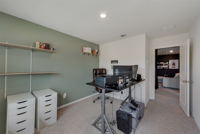 office area featuring light carpet