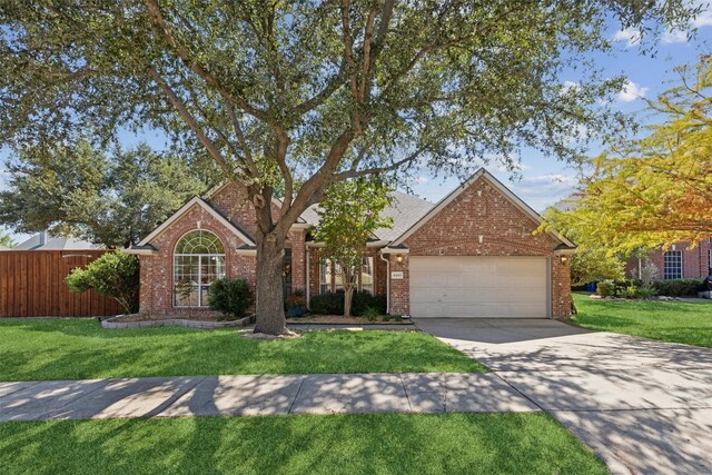 view of front of house with a front lawn and a garage