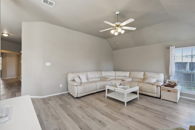 living room with ceiling fan, light hardwood / wood-style flooring, and lofted ceiling