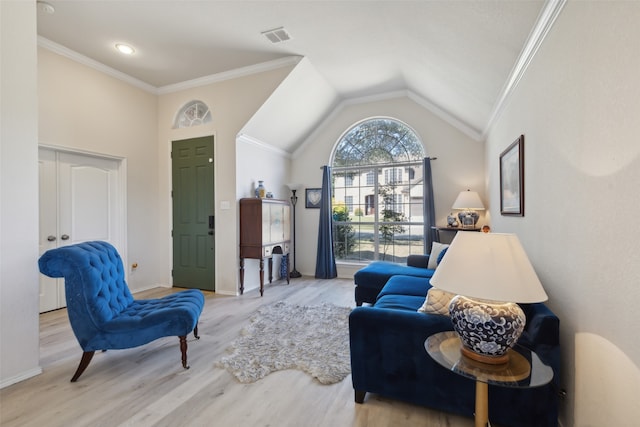 living room with vaulted ceiling, light hardwood / wood-style flooring, and crown molding