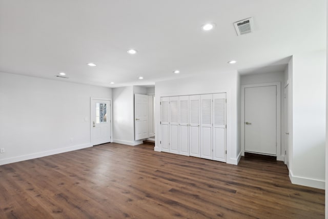 spare room featuring dark hardwood / wood-style flooring