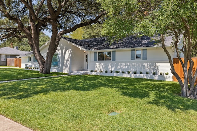 ranch-style house with a front lawn