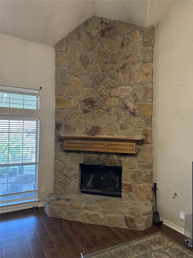 interior details featuring hardwood / wood-style flooring and a fireplace