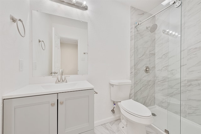 bathroom featuring a shower with door, vanity, and toilet