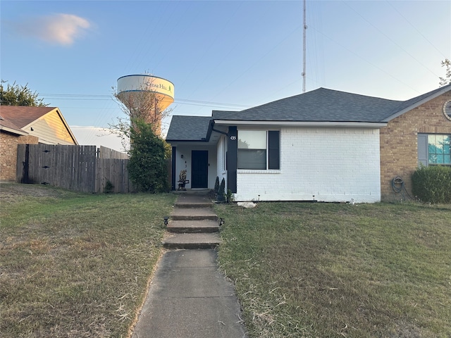 view of front of home with a front yard