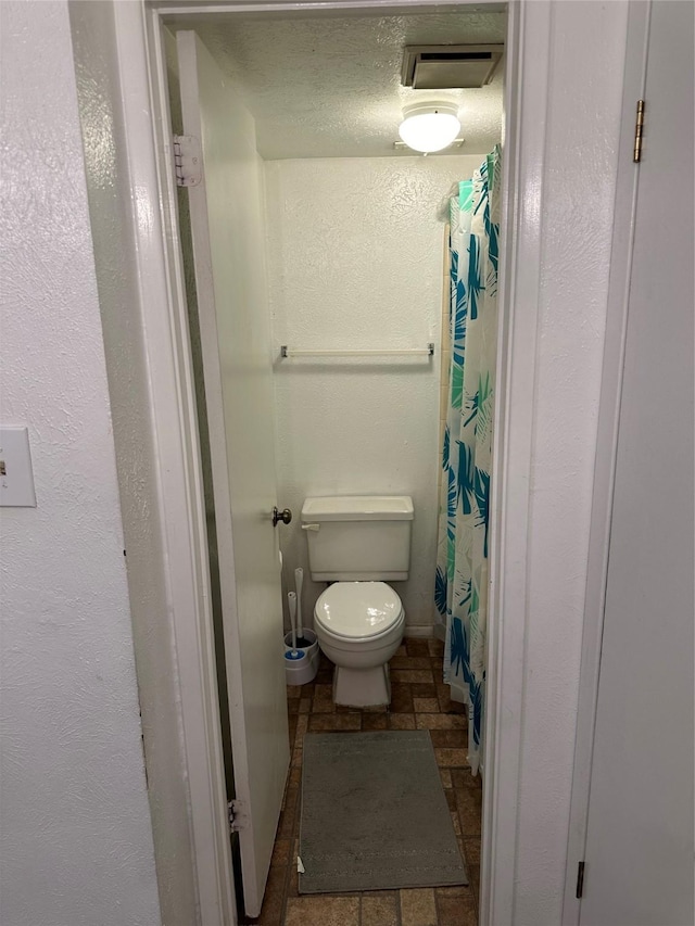 bathroom featuring toilet