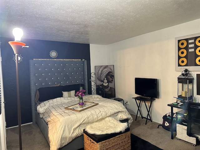 bedroom with carpet and a textured ceiling