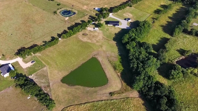 birds eye view of property with a rural view