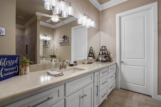 bathroom featuring ceiling fan, tile patterned floors, crown molding, a shower, and vanity