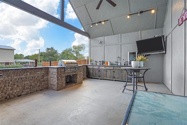 view of patio / terrace with an outdoor kitchen, ceiling fan, and grilling area