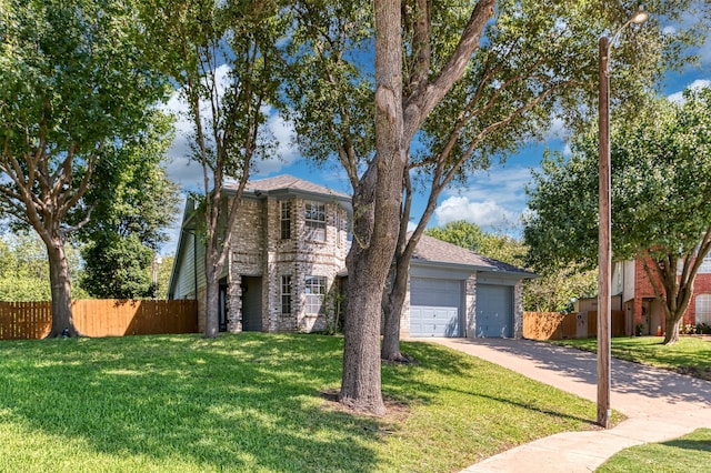 view of front of house featuring a garage and a front yard