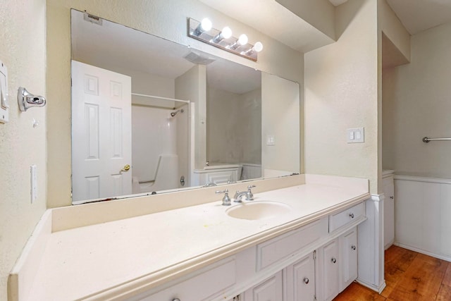 bathroom with wood-type flooring and vanity