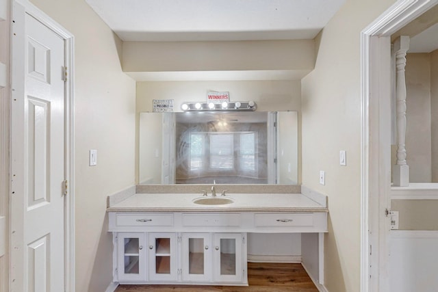 bathroom with vanity and hardwood / wood-style floors