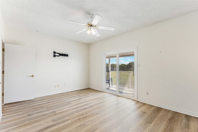 spare room with ceiling fan, a textured ceiling, and light hardwood / wood-style flooring