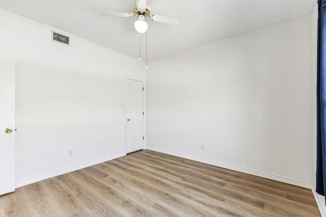 unfurnished room featuring ceiling fan and light hardwood / wood-style flooring