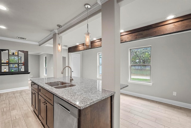 kitchen featuring sink, hanging light fixtures, light stone counters, stainless steel dishwasher, and crown molding