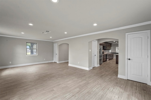 spare room with crown molding