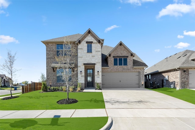 7701 Oakmeade St, Joshua, TX 76058 - view of front facade featuring brick siding, driveway, stone siding, and an attached garage